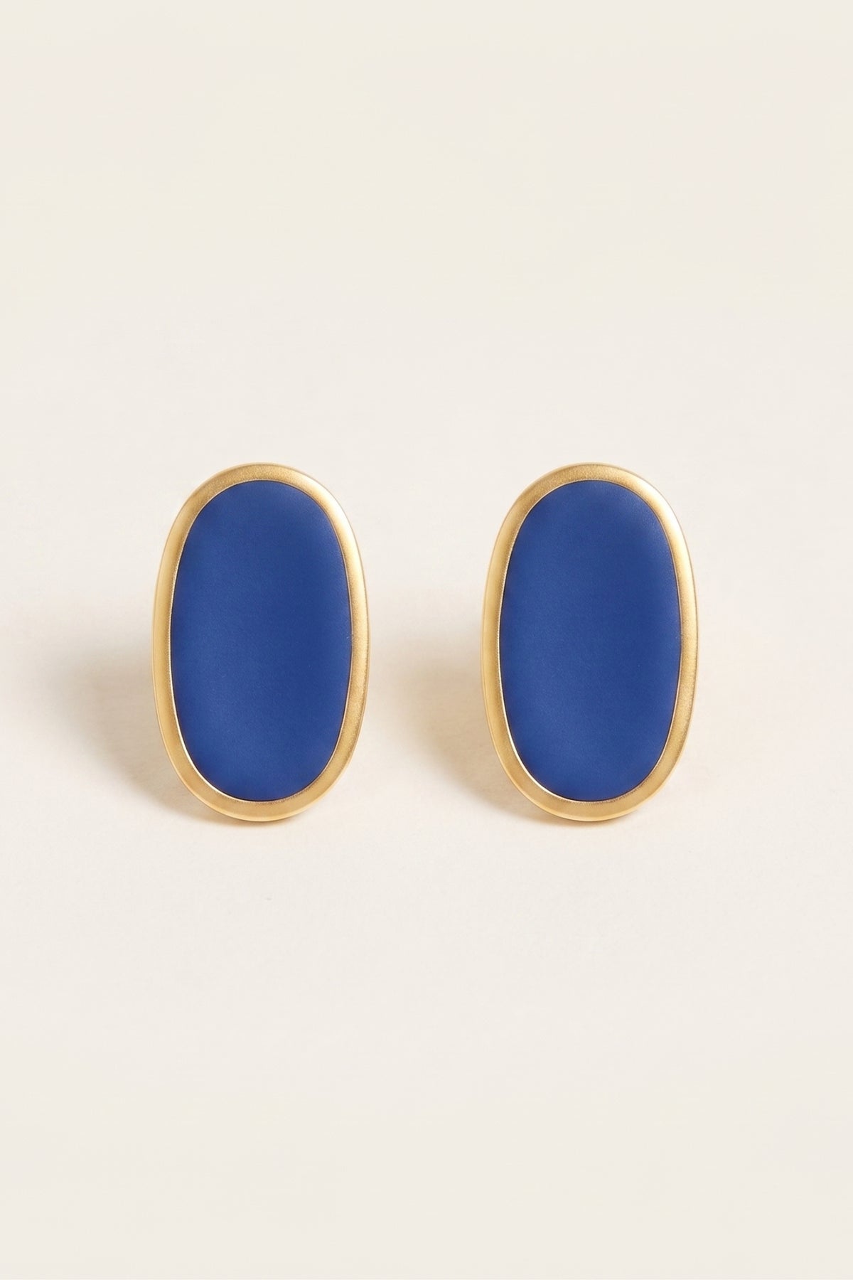 Navy Alexis Oval Enamel Post Earrings on a cream background