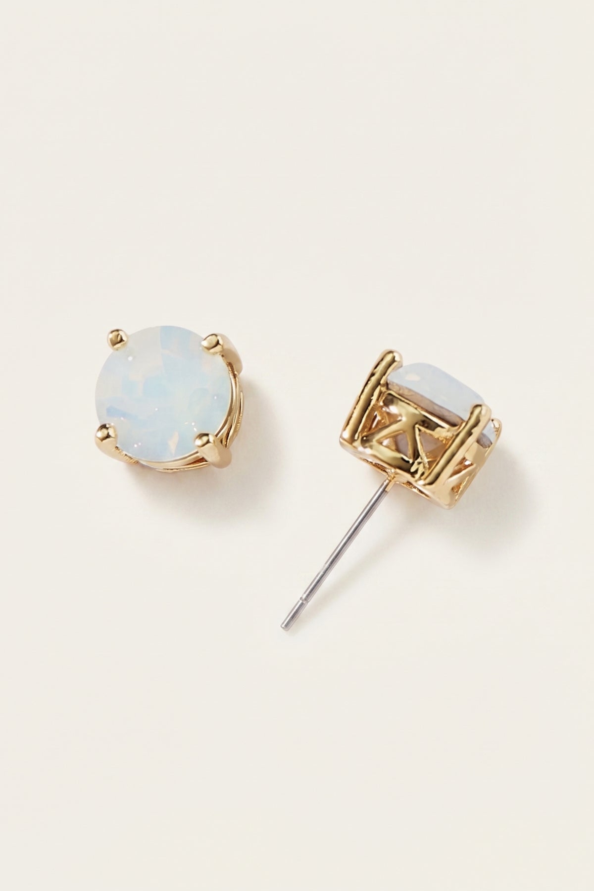 Opal Glow Statement Stud Earrings on a cream background