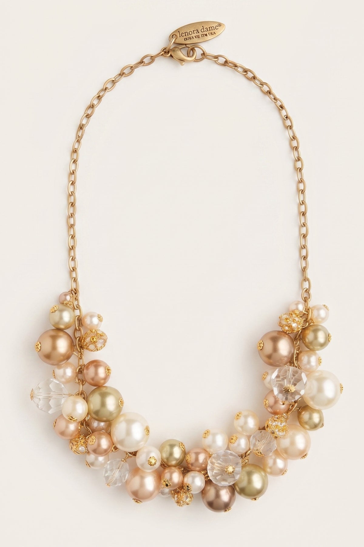 Pearl Charm Necklace on a cream background