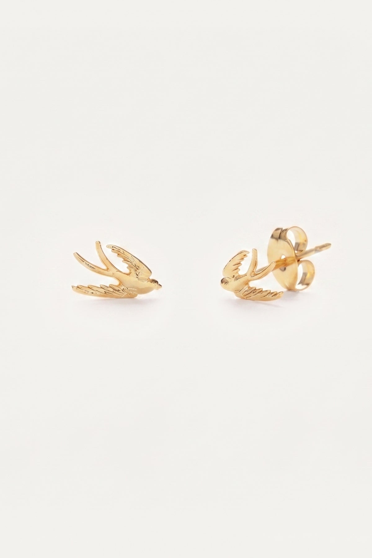 Swallow Bird Stud Earrings on a cream background